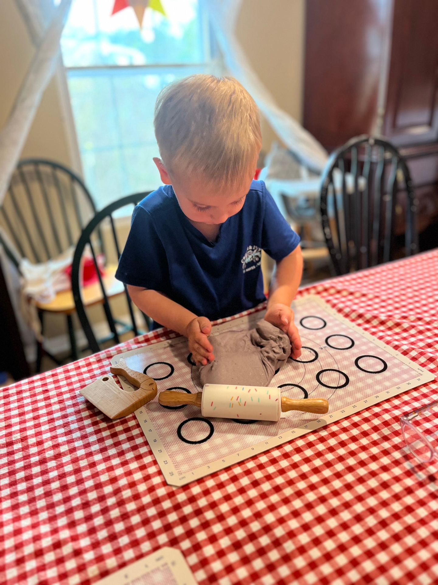 Children rolling out dough