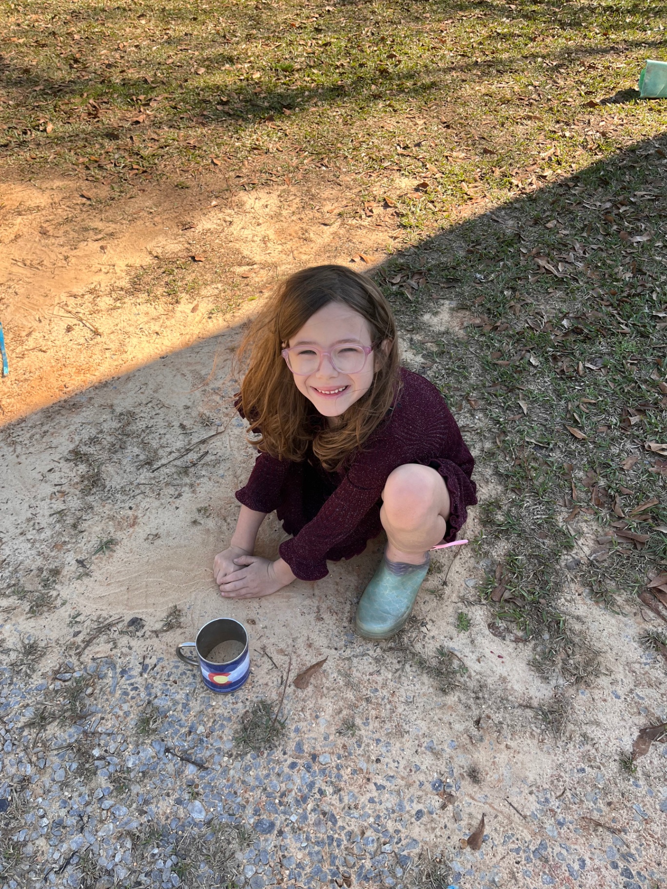 Children playing in the sand outdoors