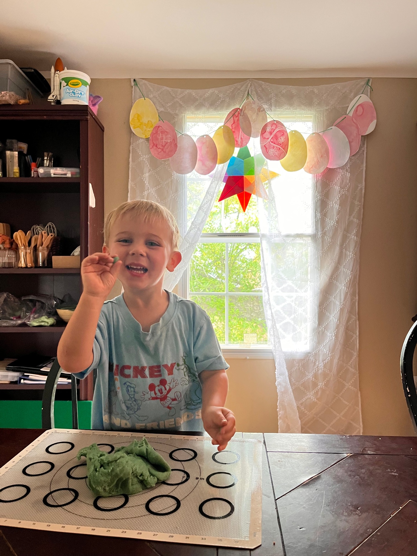 A child working independently on schoolwork in a cozy reading nook